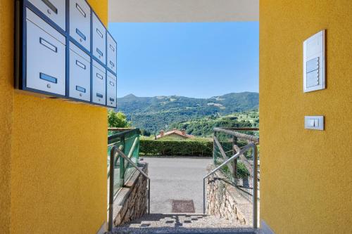 a stairway leading to a building with a yellow wall at Casa Antonia in Brentonico