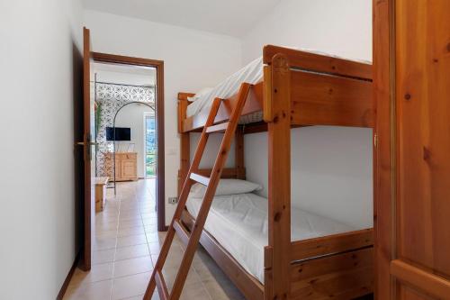a couple of bunk beds in a room with a doorway at Casa Antonia in Brentonico
