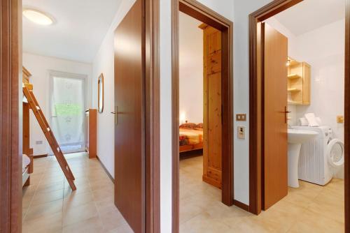 a bathroom with a sink and a toilet in a room at Casa Antonia in Brentonico