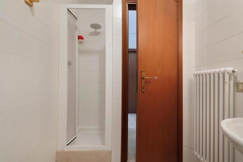 a bathroom with a shower and a toilet and a sink at Casa Antonia in Brentonico