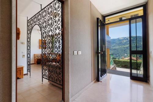 a hallway with a door with a view at Casa Antonia in Brentonico