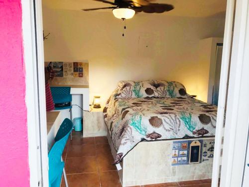 a bedroom with a bed and a ceiling at Peaceful Beach Studio in the Heart of Puntas in Rincon