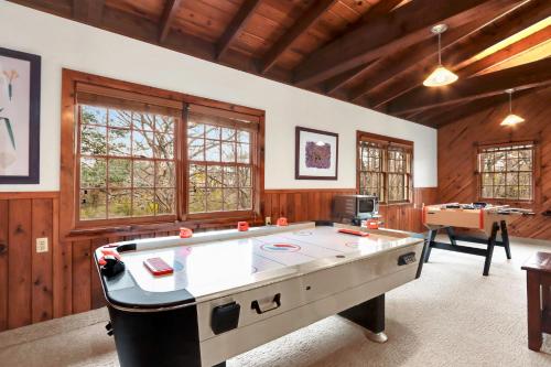 a large room with a pool table in it at Mill Lodge in Wimberley