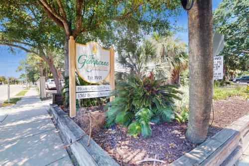 a sign for a restaurant on the side of a street at Georgianne Suite Five in Tybee Island