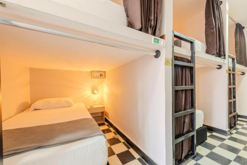 Postel nebo postele na pokoji v ubytování Hostel Dorado Plaza Getsemaní