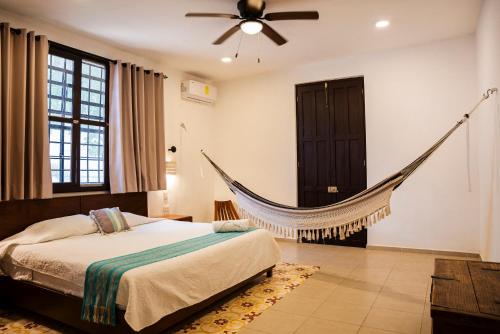 Ένα ή περισσότερα κρεβάτια σε δωμάτιο στο Casa Grande 5 Blocks To Montejo