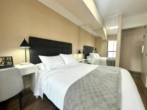 Katil atau katil-katil dalam bilik di Modern 1BR on J Prado Board San Isidro