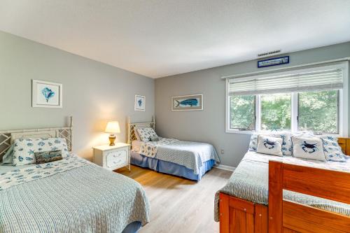 a bedroom with two beds and a window at about 1 Block to Bethany Beach, Retreat with Pool Access in Bethany Beach