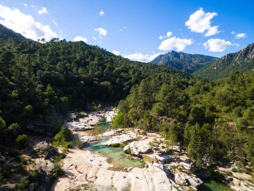 an aerial view of a river in the mountains at Chalet Caseddu D'Arasu by Interhome in Sainte-Lucie de Porto-Vecchio