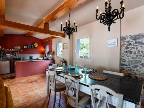 a kitchen and dining room with a table and chairs at Apartment A Dutch Place by Interhome in Airole