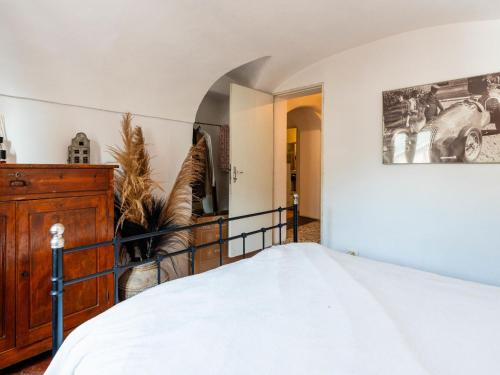 a bedroom with a bed and a hallway at Apartment A Dutch Place by Interhome in Airole