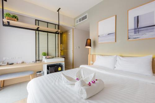 Säng eller sängar i ett rum på Snoozz Hotel Krabi