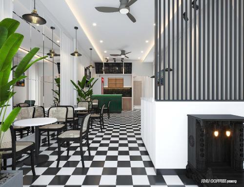 a restaurant with a black and white checkered floor at Misa House - Starlit Saigon in Ho Chi Minh City