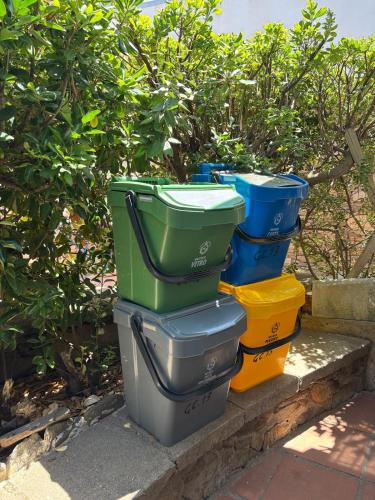 a group of four toilets sitting on a curb at Casa Aaron - Monolocale con veranda sul mare in Stintino
