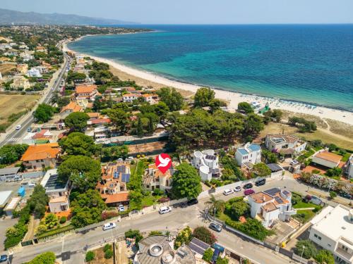 an aerial view of a town next to the beach at Villa Villa Al Mare by Interhome in Su Forti