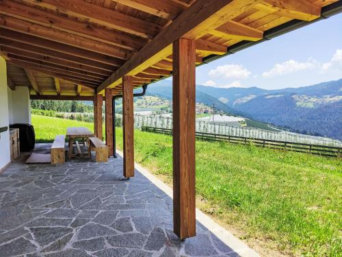 a covered patio with a view of a mountain at Apartment Larice Bilocale by Interhome in Livo