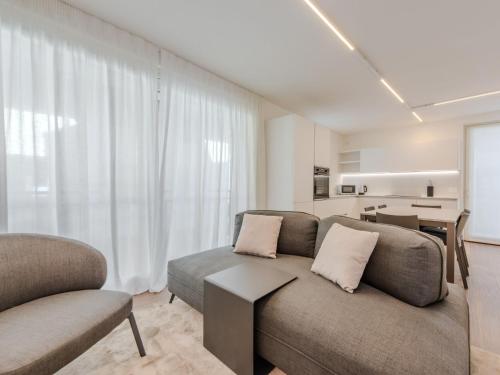 a living room with a couch and a table at Apartment Maria by Interhome in Pinzolo