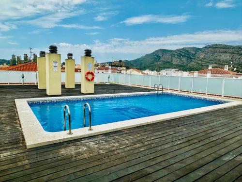a swimming pool on the roof of a building at Villamagna Pueblo Vidaber in Oropesa del Mar