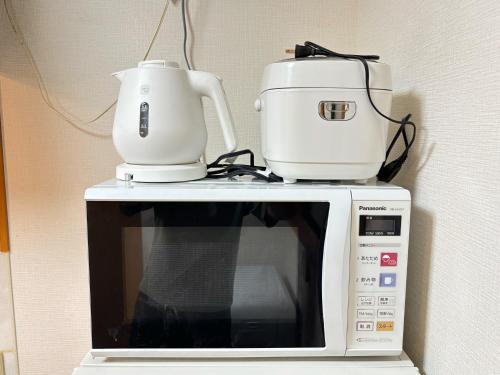 Una cocina o zona de cocina en Villa FUNABASHI