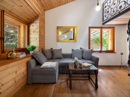 a living room with a couch and a table at Apartment Larice by Interhome in San Bernardino