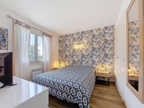 Ένα ή περισσότερα κρεβάτια σε δωμάτιο στο Holiday Home L'Escale by Interhome