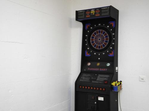 a dart board in a corner of a wall at Apartment La Siala Apt-66 by Interhome in Falera