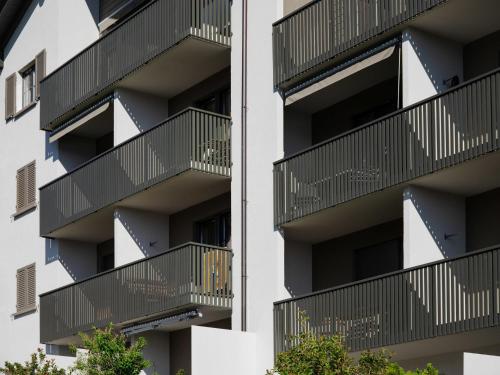 an apartment building with balconies on the side at Apartment La Siala Apt-66 by Interhome in Falera