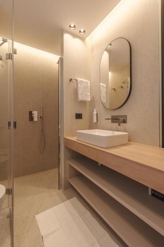 a bathroom with a sink and a mirror at Campoblù in Marina di Campo