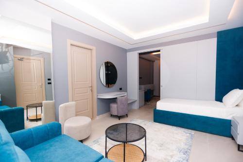 a living room with a bed and a couch at Hotel 6 Marsi in Golem