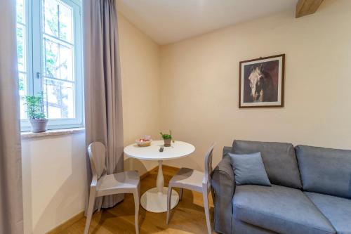 a living room with a couch and a table at Al Torrione in Collecchio