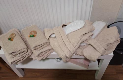 a pile of towels sitting on top of a table at Haus Hoogendam in Leoben