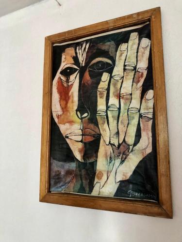 a painting of a lioness on a wall at Hostal Inty Kucha in Otavalo