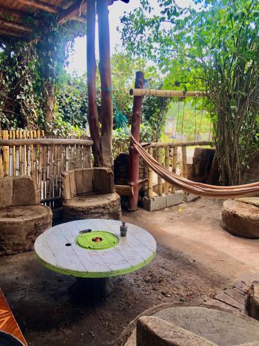 a surfboard sitting on a table with a hose at Hostal Inty Kucha in Otavalo