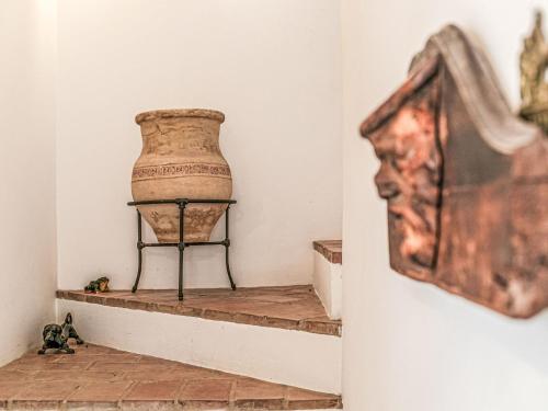 a vase sitting on a shelf in a room at Villa Las Codornices-2 by Interhome in Sanlúcar la Mayor