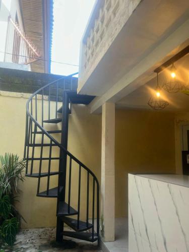 a staircase in the side of a building at Oemah Dharma Garden View by EPS in Gianyar