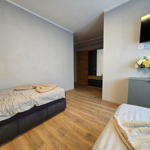 Ένα ή περισσότερα κρεβάτια σε δωμάτιο στο Boardinghouse Naim