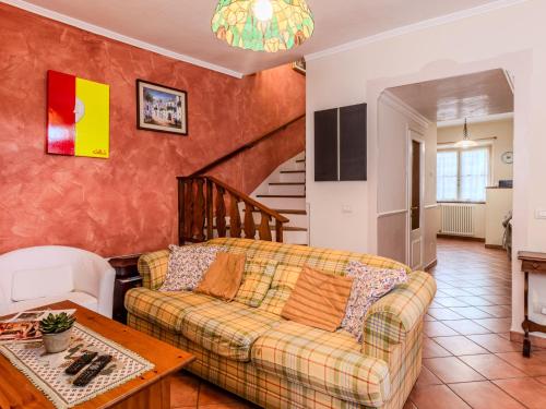 a living room with a couch and a table at Apartment Torchio by Interhome in Carlazzo