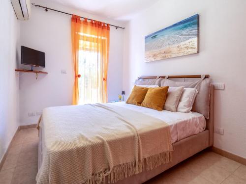Postel nebo postele na pokoji v ubytování Apartment Baia delle Mimose by Interhome