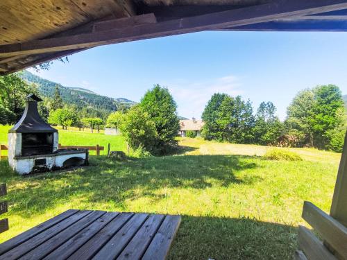 a view of a yard from the porch of a house at Chalet Altavista by Interhome in Ziano di Fiemme