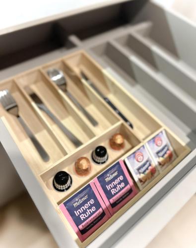 a drawer in a refrigerator with some donuts at Aparthotel Lavilo Main Square in Graz