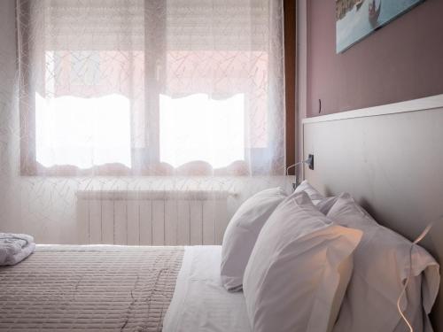 Ένα ή περισσότερα κρεβάτια σε δωμάτιο στο Hotel RB Venice