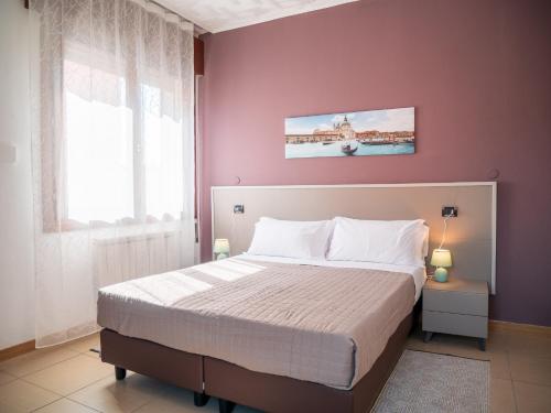 Ένα ή περισσότερα κρεβάτια σε δωμάτιο στο Hotel RB Venice