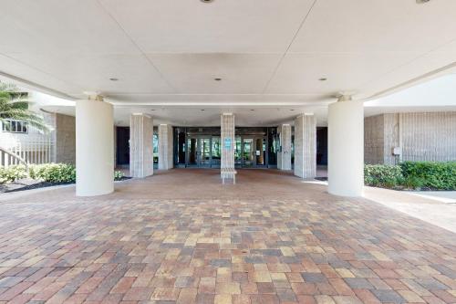 an empty lobby of a building with columns at The Breezy Perch in Marco Island