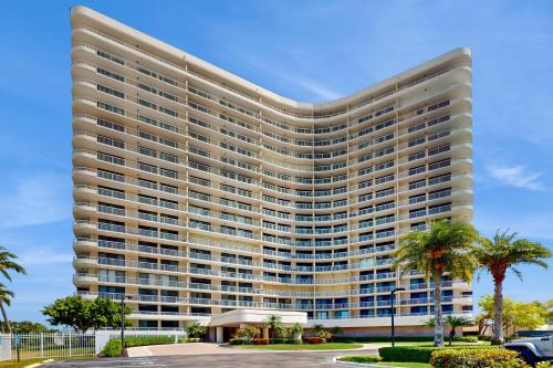 a rendering of a large building with palm trees at The Breezy Perch in Marco Island