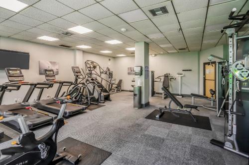 a gym with treadmills and elliptical machines at The Breezy Perch in Marco Island
