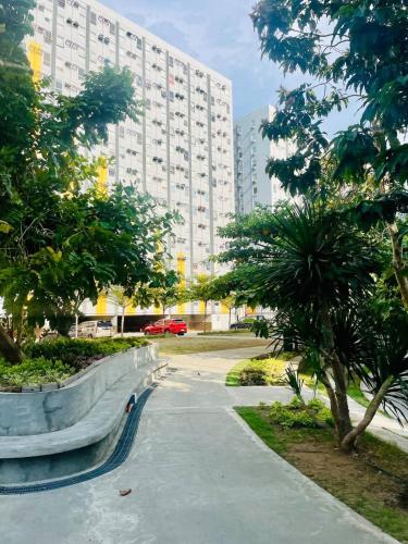 a skate park in front of a large building at Zen Vibes Modern 2BR Asian Fusion Stay in Manila