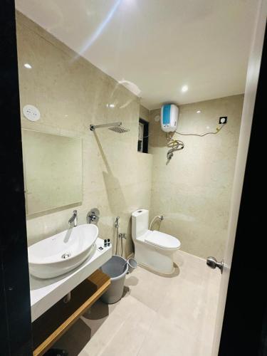 a bathroom with a sink and a toilet at C Pixels in Bhīmunipatnam