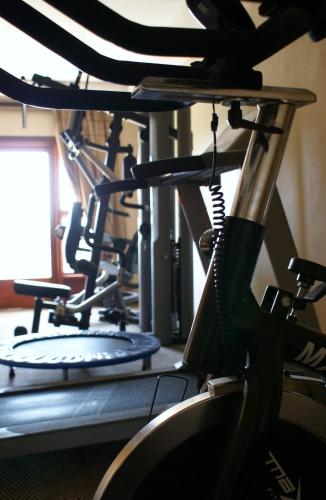 a row of exercise bikes in a gym at Attaché Guest Lodge & Health Spa in Midrand