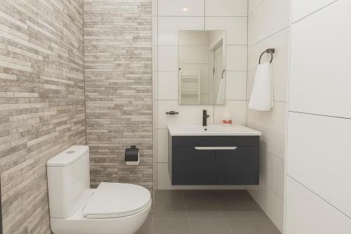 a bathroom with a toilet and a sink at Dilijan Best View in Dilijan