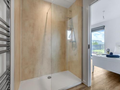 a shower with a glass door in a bathroom at Faodail in Portree